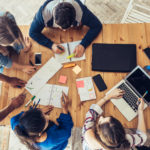 A team discusses the four Ps of marketing.
